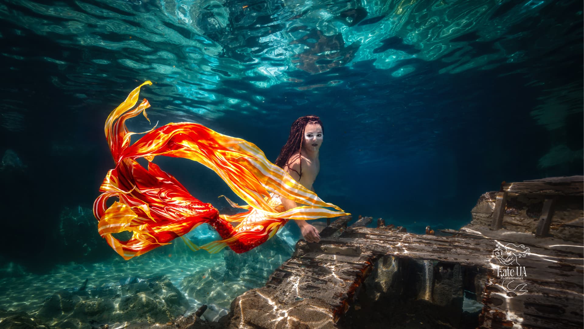 Prince Pōhaku resting a hand on a submerged wooden wreck, fiery tail flowing behind him